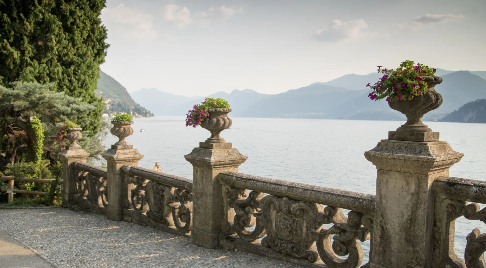 The ornate stone balustrade and flower urns of Villa del Balbianello above Lake Como